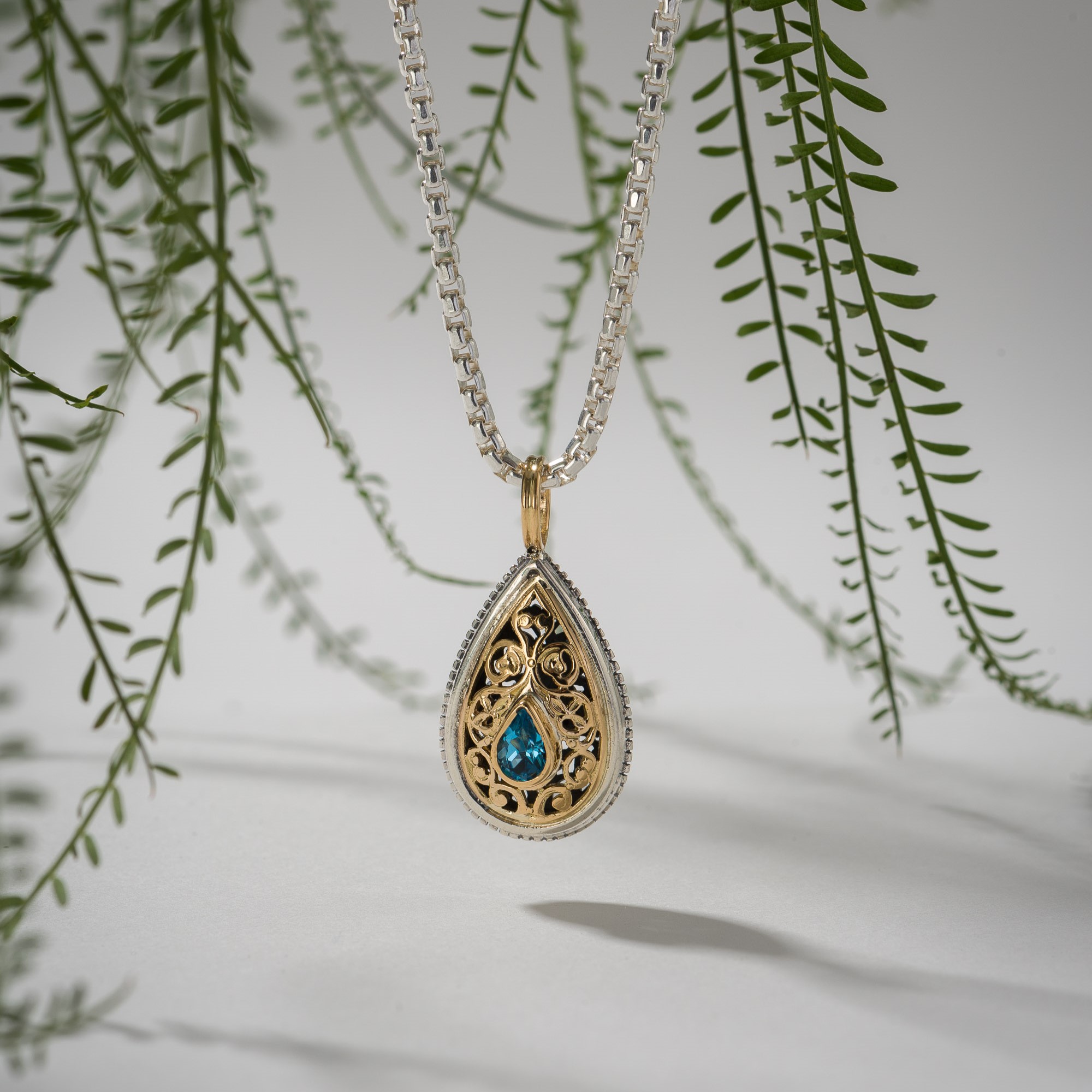 Garden Shadows drop Pendant in 18K Gold and Sterling Silver with blue Topaz