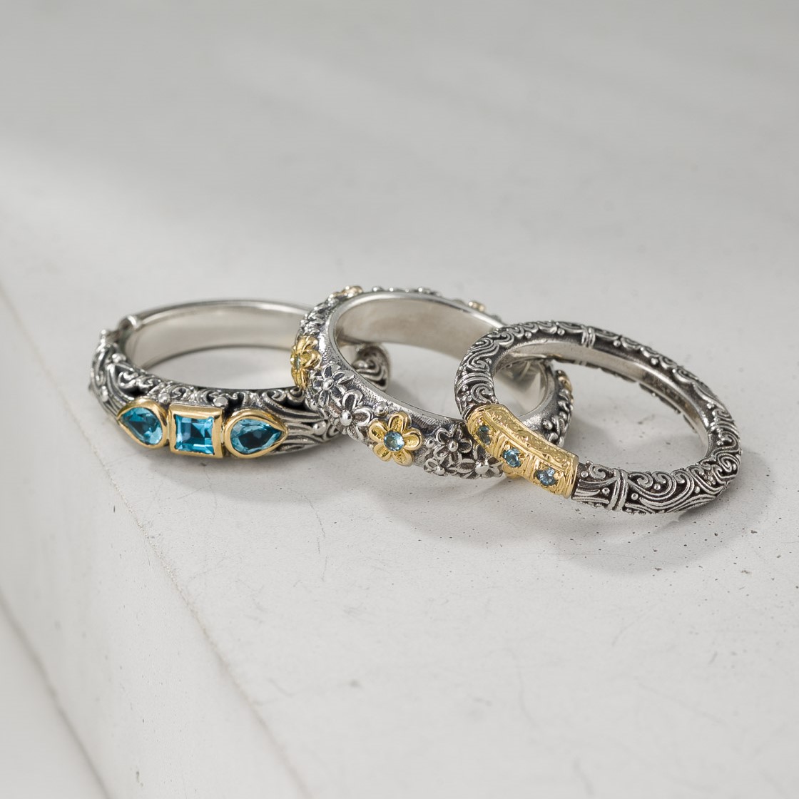 Ring Trilogies in 18K Gold and Sterling Silver with Blue topaz