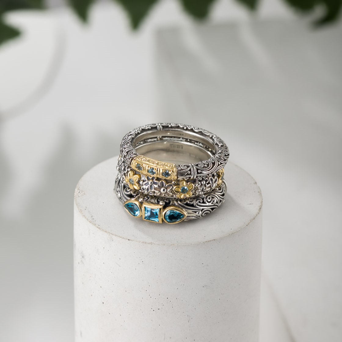 Ring-Trilogies-in-18K-Gold-and-Sterling-silver-with-Blue-topaz